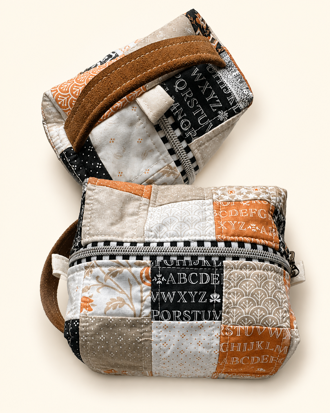 Leather Alpha Zip bag shown from the front and angled handle view